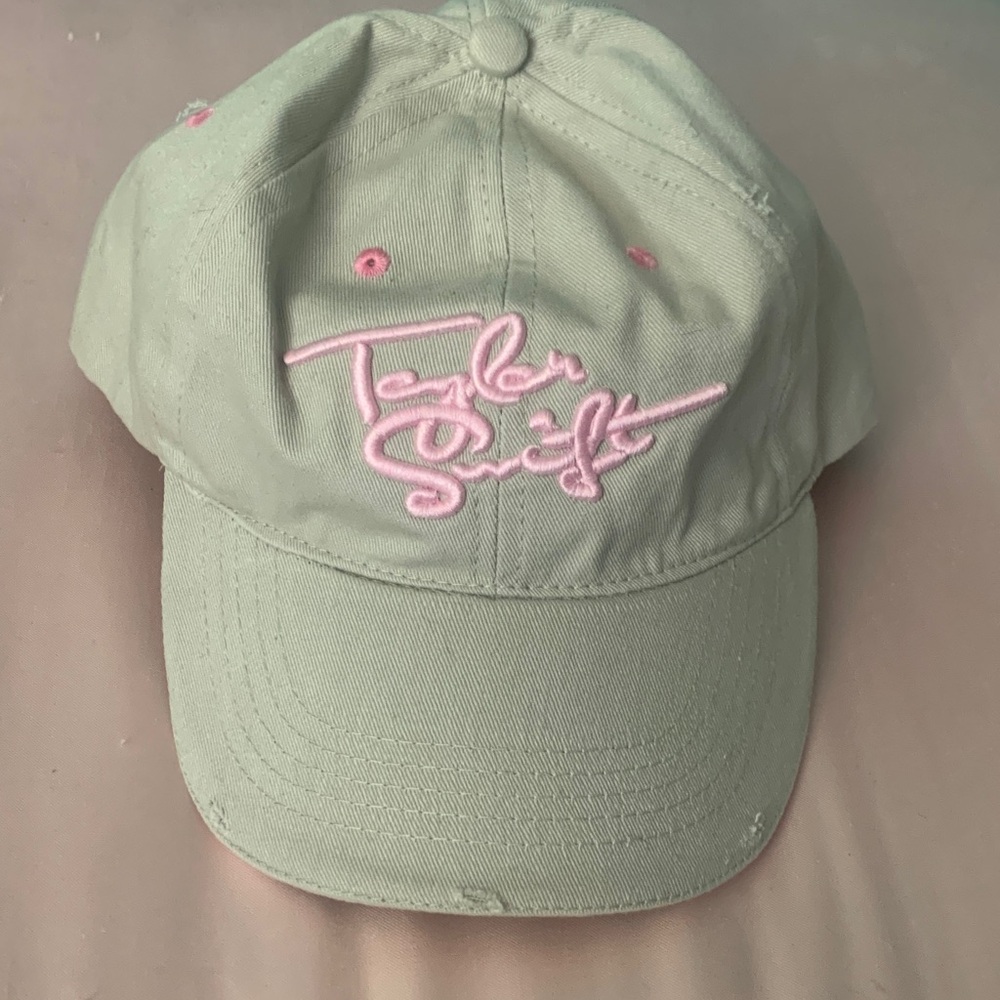 Taylor Swift women’s beige Cap with Pink logo and accents